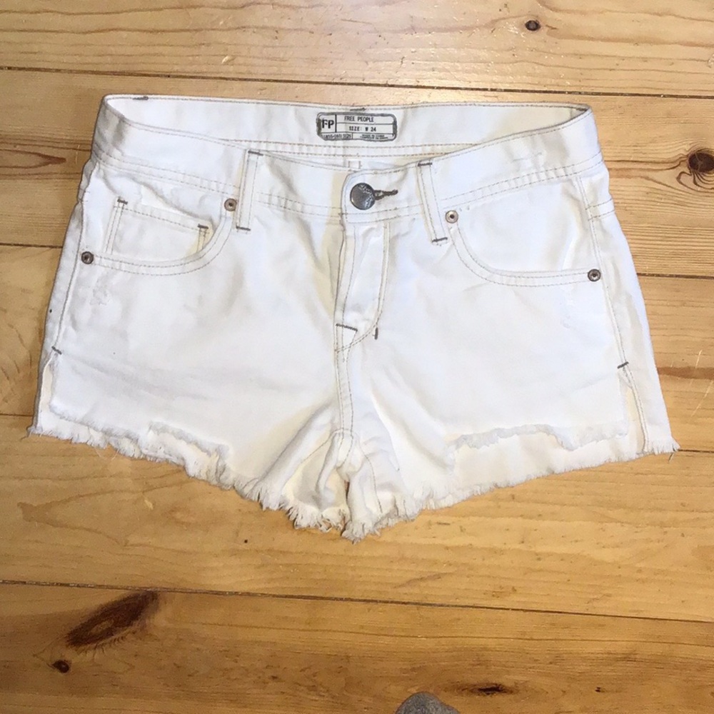 Free People distressed white shorts